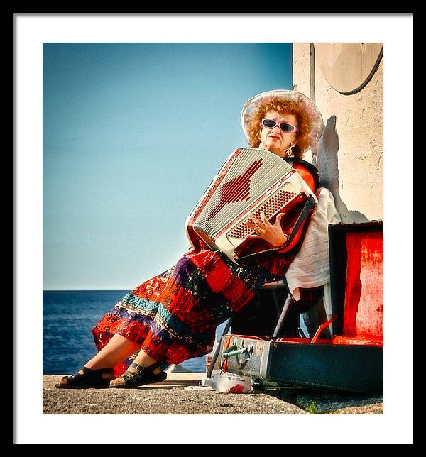 Accordion player lady at Peggy's Cove, Nova Scotia framed art print