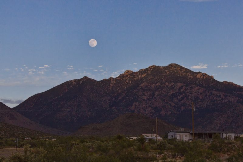 Full solstice moon over Cerbat Mountains in Dolan Springs, Mohave Desert, Arizona